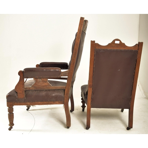 257 - A near matched pair of late Victorian carved oak & brown leather ladies & gentleman's armchairs. The... 