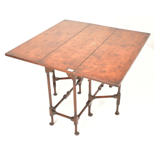 258 - A George III 18th century walnut spider leg drop leaf table. The table having straight drop leaf top... 