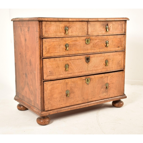 268 - A 17th century Queen Anne walnut chest of drawers. The chest having a crossbanded top with geometric... 