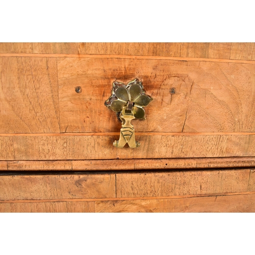 268 - A 17th century Queen Anne walnut chest of drawers. The chest having a crossbanded top with geometric... 