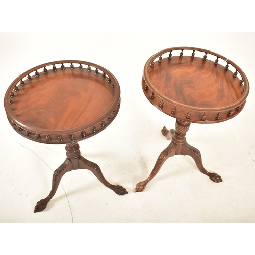 269 - A matched pair of Regency Revival mahogany gallery top tripod wine tables. Each having a turned spin... 