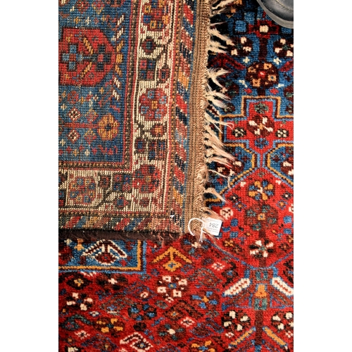 284 - A large 20th century Azimi Persian hand knotted floor carpet rug. The rug having a central fielded p... 