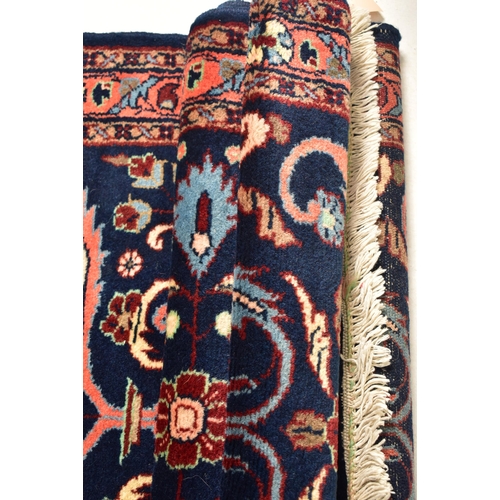 289 - A 20th century 1950s Lilihan Persian floor carpet rug runner. The runner having a cobalt blue ground... 