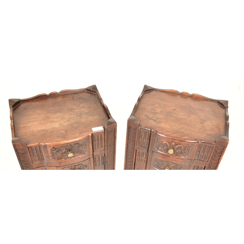 297 - A pair of 19th century  continental French carved walnut bedside pot cupboards. Each bedside cabinet... 