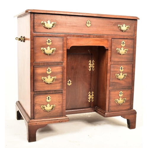 299 - A George III 19th century mahogany kneehole ladies pedestal writing desk. The desk having a shaped c... 