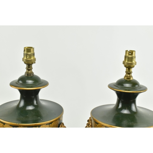 304 - A pair of Regency style toleware painted metal desk table lamps in the shape of handled urns. Each l... 