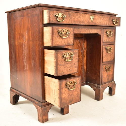 313 - A George III early 19th century walnut kneehole ladies pedestal writing desk. The desk having a rais... 