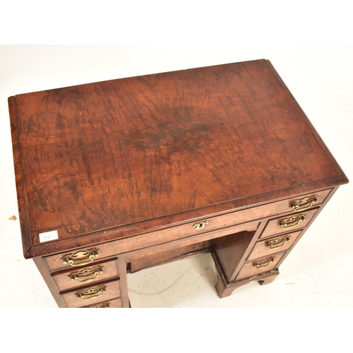 313 - A George III early 19th century walnut kneehole ladies pedestal writing desk. The desk having a rais... 