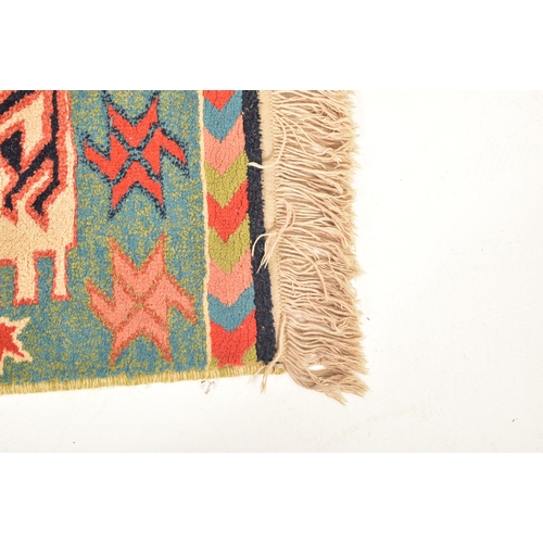 316 - A 20th century Afghan Islamic Kilim floor carpet rug. The carpet having a central geometric diamond ... 