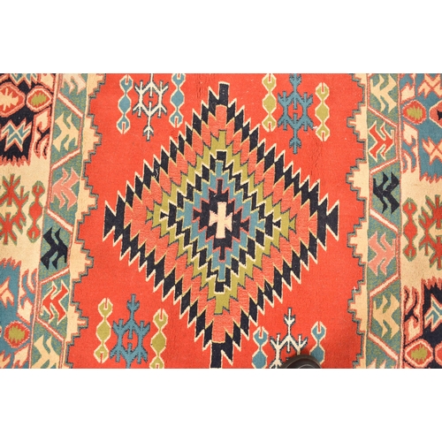 316 - A 20th century Afghan Islamic Kilim floor carpet rug. The carpet having a central geometric diamond ... 