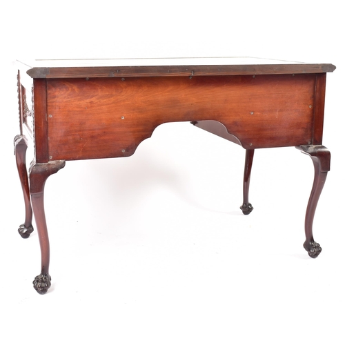 319 - A Robert Adams revival mahogany writing desk table. The desk having a central writing skiver surroun... 