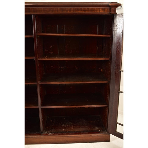 323 - A large George III early 19th century mahogany astragal glazed library bookcase cabinet. The cabinet... 