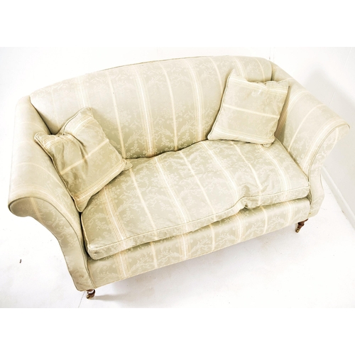 330 - A 20th century upholstered Chesterfield three seater sofa in the manner of Howard & Sons. The sofa h... 