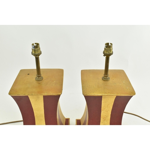 338 - Porta Romana - A pair of gold & red painted geometric desk table lamps. Each lamp with a brass light... 