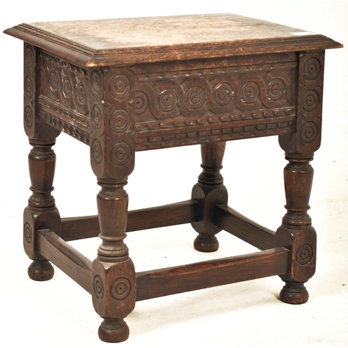 341 - A 17th century style carved oak lift top joint stool. The stool having a chamfered edge lift top ope... 