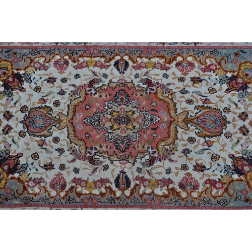 348 - A late 20th century wool with silk Iranian Persian Islamic raj Tabriz carpet floor rug. The rug havi... 