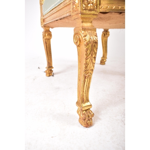 352 - A 19th century French Louis XVI gilt wood fauteuil bergere lounge armchair. The chair having a torch... 