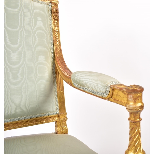 352 - A 19th century French Louis XVI gilt wood fauteuil bergere lounge armchair. The chair having a torch... 