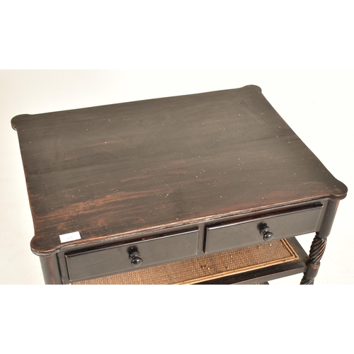 364 - An ebonised mahogany whatnot etagere table in the Aesthetic Movement manner. The table having a shap... 