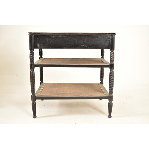 364 - An ebonised mahogany whatnot etagere table in the Aesthetic Movement manner. The table having a shap... 