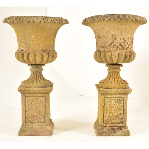 370 - A pair of carved reconstituted stone Neo-Classical manner garden planters. Each planter shaped like ... 