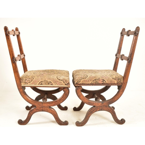 379 - A pair of late 19th century carved oak Gothic inspired Aesthetic Movement dining chairs. Each chair ... 