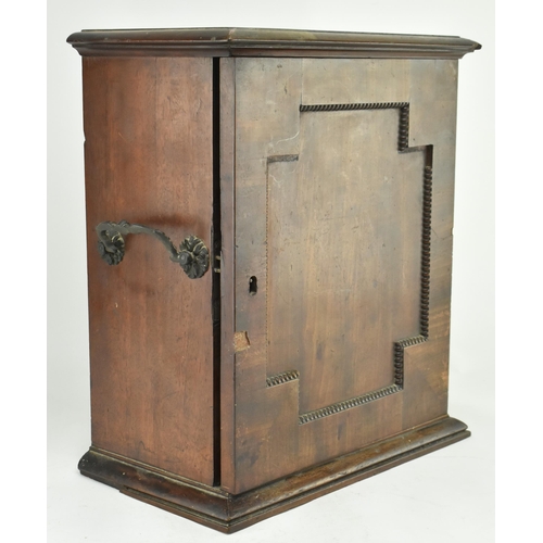 383 - An early 20th century mahogany watchmakers specimen chest cabinet. The cabinet having a chamfered fl... 