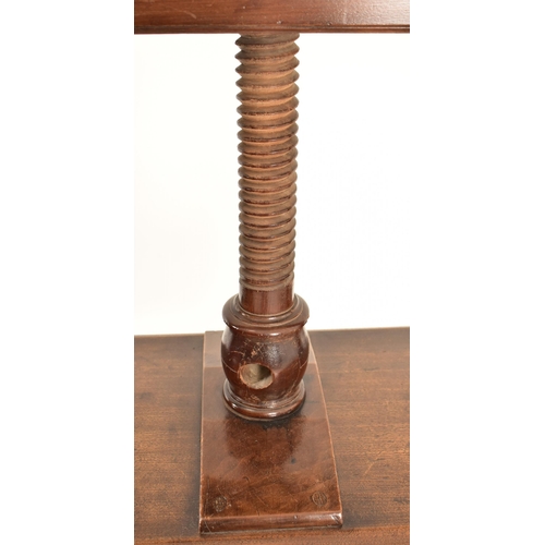 384 - A George III 18th century oak book press on table stand. The press having a large upright central wo... 