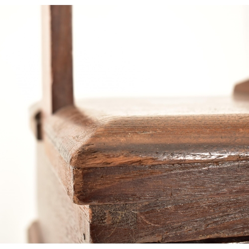 384 - A George III 18th century oak book press on table stand. The press having a large upright central wo... 