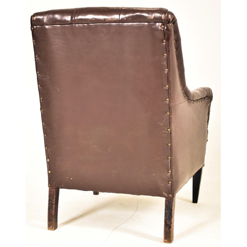 385 - A Victorian style 20th century brown leather button back Chesterfield armchair. The armchair having ... 