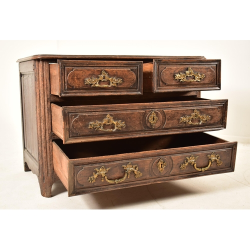 388 - A French 19th century oak commode / chest of drawers. The chest having a shaped top with chamfered e... 