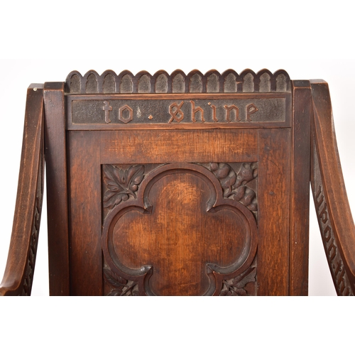 392 - A Victorian 19th century carved oak Glastonbury chair. The chair having a squared frame with shaped ... 