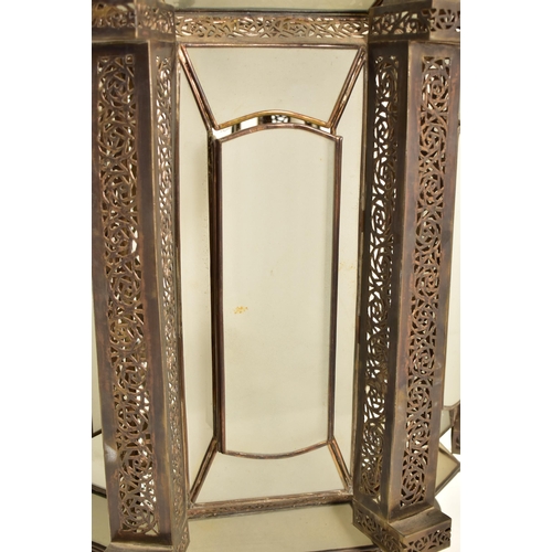 401 - A large Islamic inspired pierced metal & glazed Mosque temple ceiling lantern light. The lantern of ... 