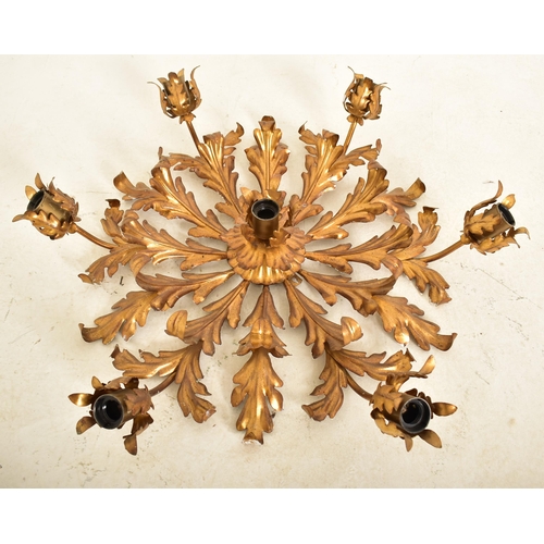 607 - An Italian inspired toleware style gilt metal six arm ceiling light. The chandelier having six arms ... 