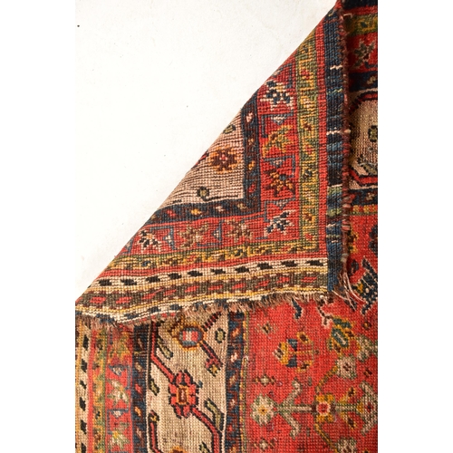 610 - A 19th century hand woven Persian Islamic Bidjar floor carpet rug. The rug having a central shaped m... 