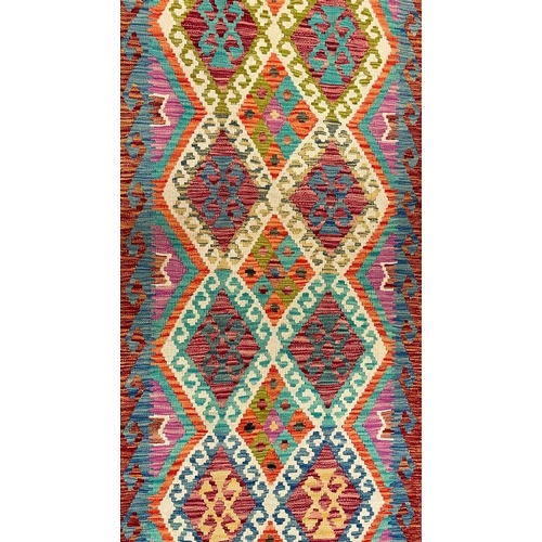 311 - A 20th century Anatolian Turkish Islamic Kilim floor runner rug. The rug having a central repeating ... 