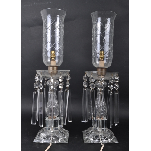 350 - A matching pair of Edwardian cut glass table lamp lights having clear glass fluted shades with etche... 