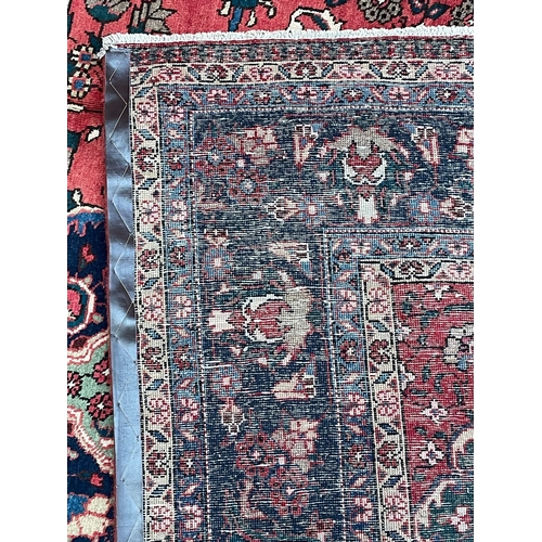 369 - An early 20th century North East Persian Islamic Meshed floor carpet rug. The rug having a central s... 