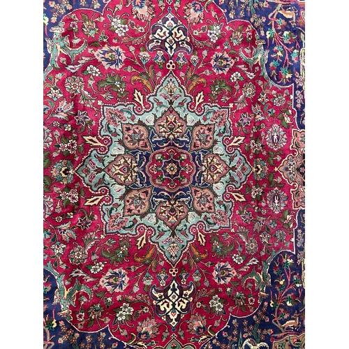 411 - An early 20th century North West Persian Islamic Tabriz floor carpet rug. The carpet having a series... 