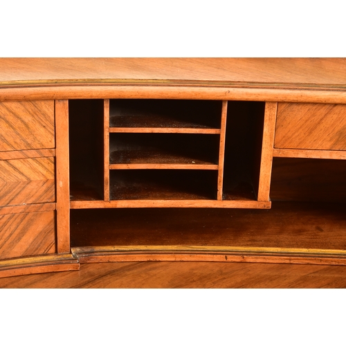 416 - A continental early 20th century walnut crossbanded twin pedestal kidney shaped desk. The desk havin... 