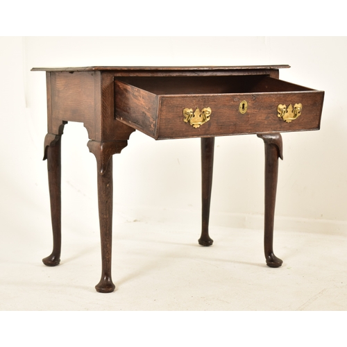 427 - A George III 18th century oak lowboy desk. The desk having single drawer to the frieze and with flar... 