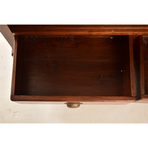 433 - A pair of Victorian style 20th century mahogany open front bookcases. Each bookcase having a cornice... 