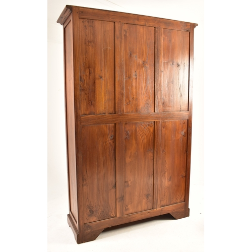 433 - A pair of Victorian style 20th century mahogany open front bookcases. Each bookcase having a cornice... 