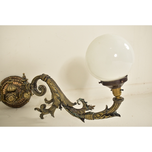 440 - An early 20th century circa 1900s French Art Nouveau cast metal twin arm wall light sconce. The ligh... 