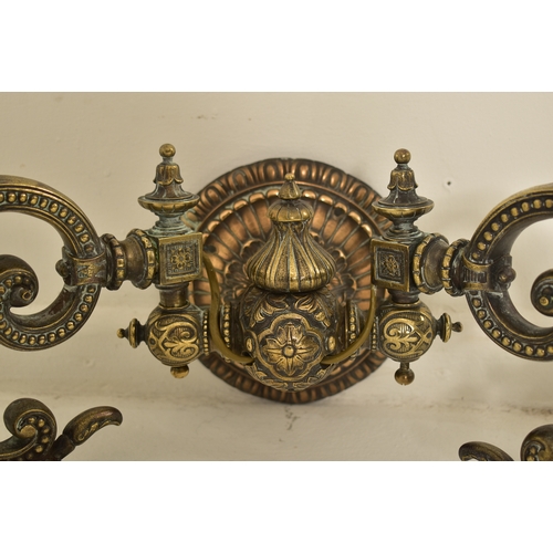 440 - An early 20th century circa 1900s French Art Nouveau cast metal twin arm wall light sconce. The ligh... 