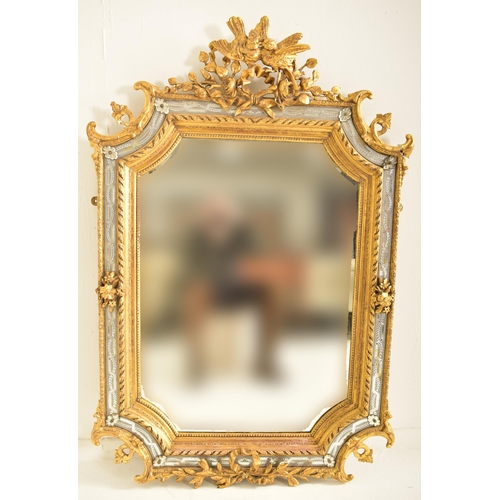 605 - A large Italian Venetian 19th century gilt gesso & wood wall hanging mirror. The mirror having an in... 