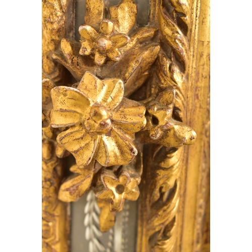 605 - A large Italian Venetian 19th century gilt gesso & wood wall hanging mirror. The mirror having an in... 