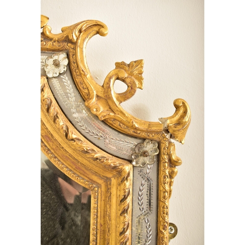 605 - A large Italian Venetian 19th century gilt gesso & wood wall hanging mirror. The mirror having an in... 