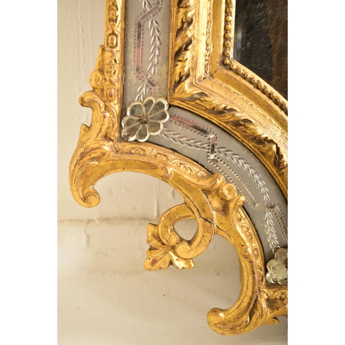 605 - A large Italian Venetian 19th century gilt gesso & wood wall hanging mirror. The mirror having an in... 