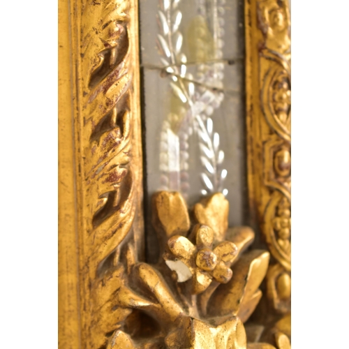 605 - A large Italian Venetian 19th century gilt gesso & wood wall hanging mirror. The mirror having an in... 